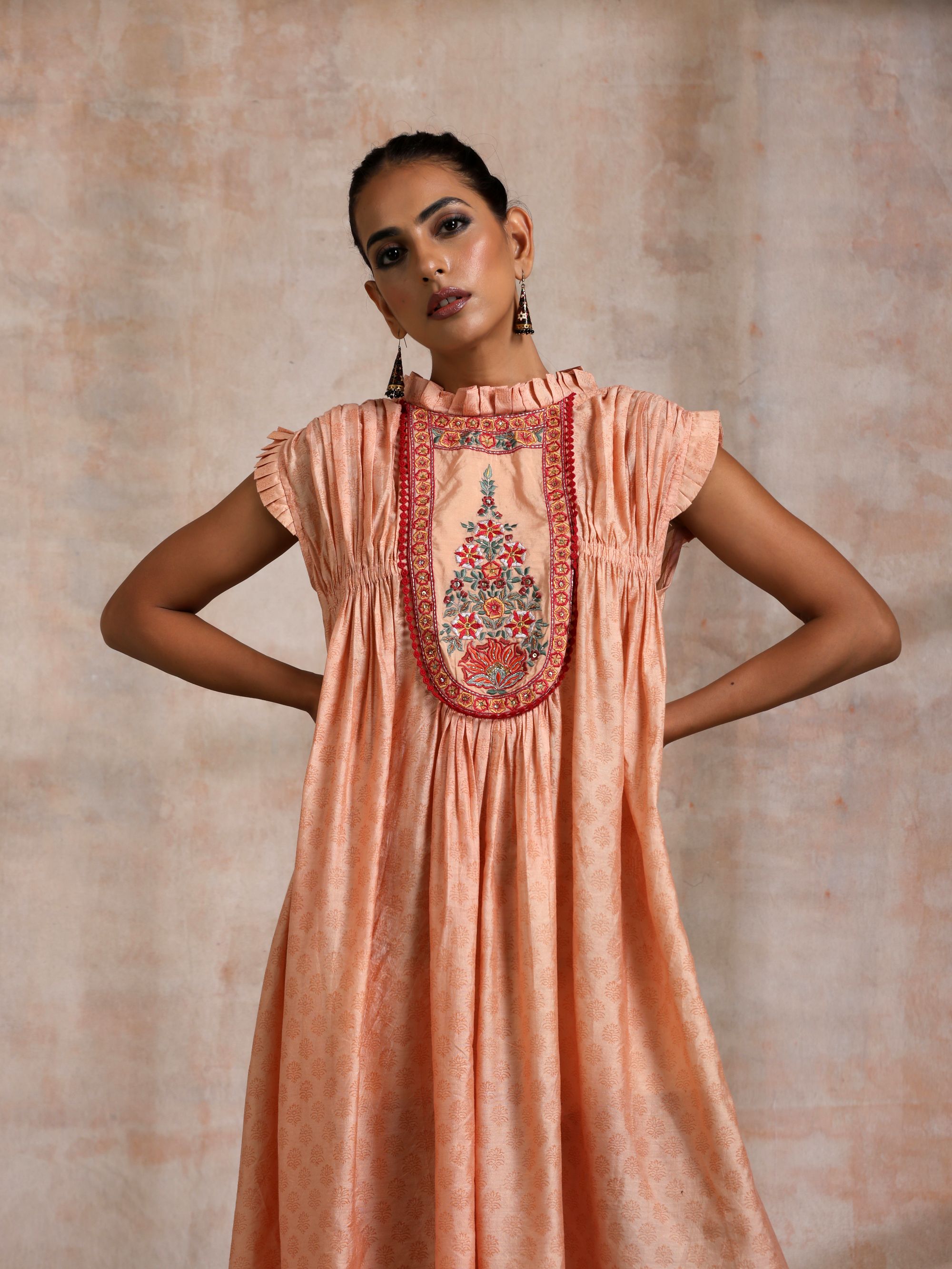 KESARI CHANDERI CHOGA WITH EMBROIDERED YOKE FRILLED COLLOR AND SLEEVES