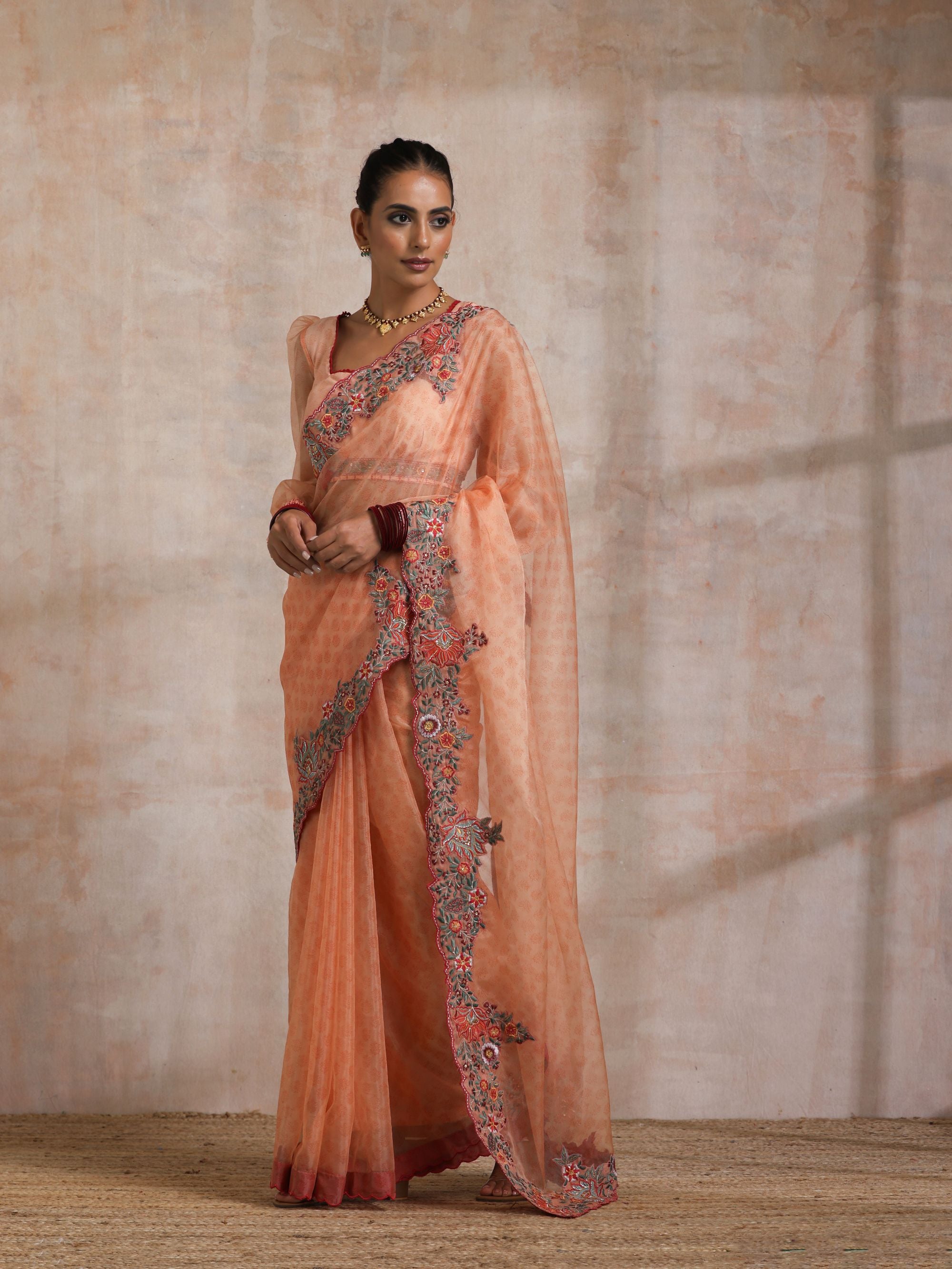 KESARI ORGANZA SAREE WITH HEAVY PALLU EMBROIDERY