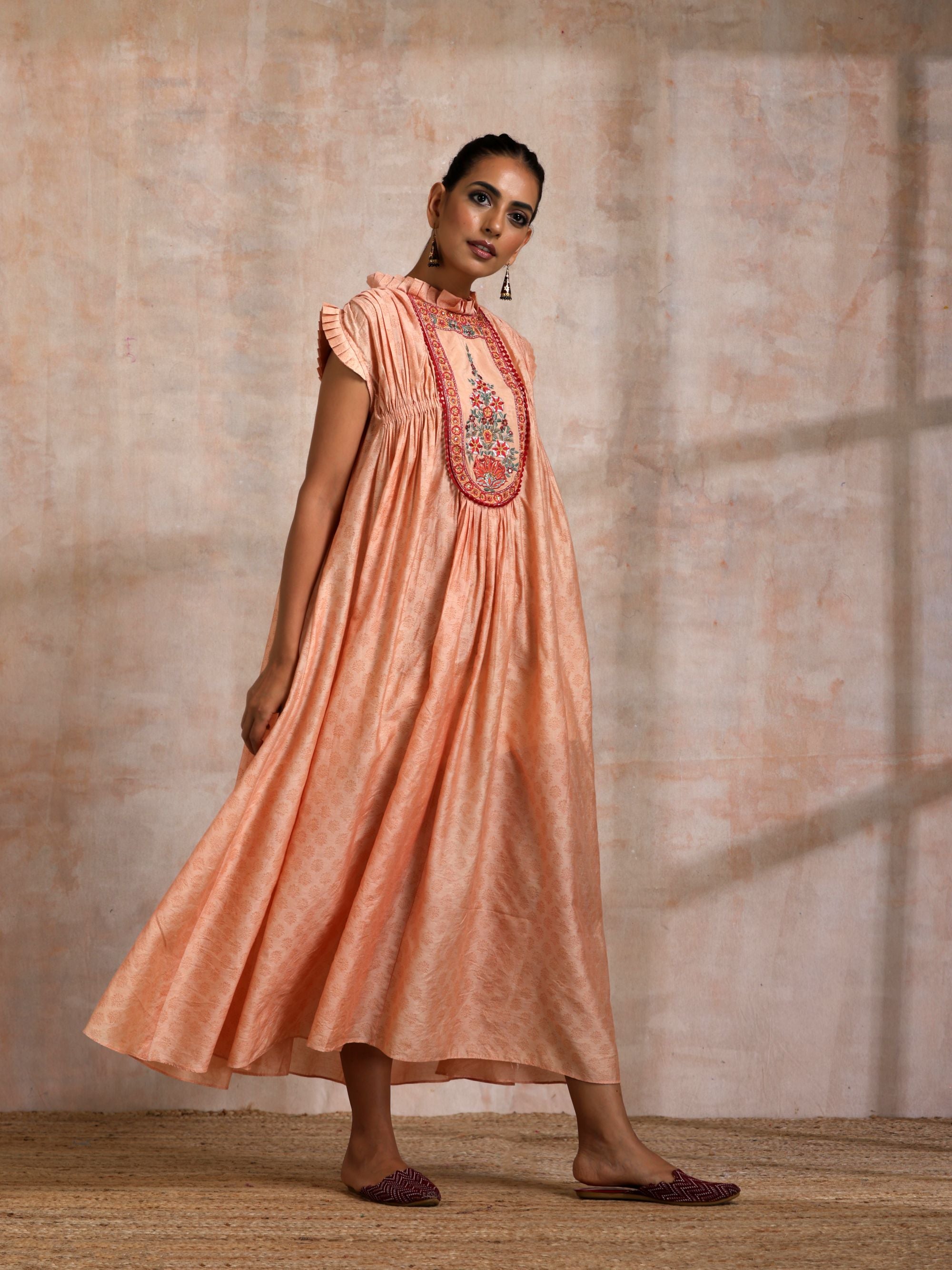 KESARI CHANDERI CHOGA WITH EMBROIDERED YOKE FRILLED COLLOR AND SLEEVES