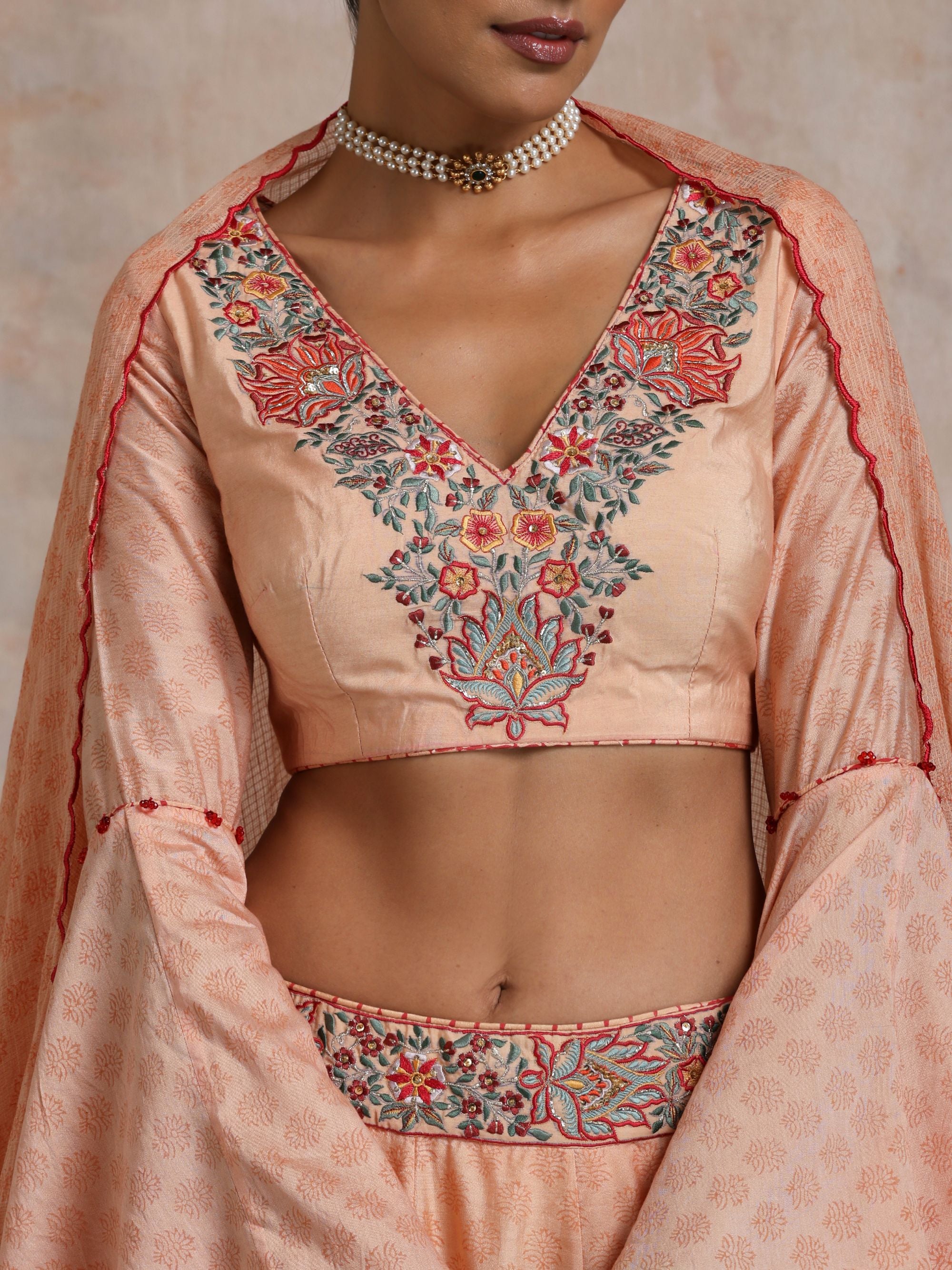 KESARI CHANDERI EMBROIDERED BORDER LEHANGA WITH BELL SLEEVES BLOUSE