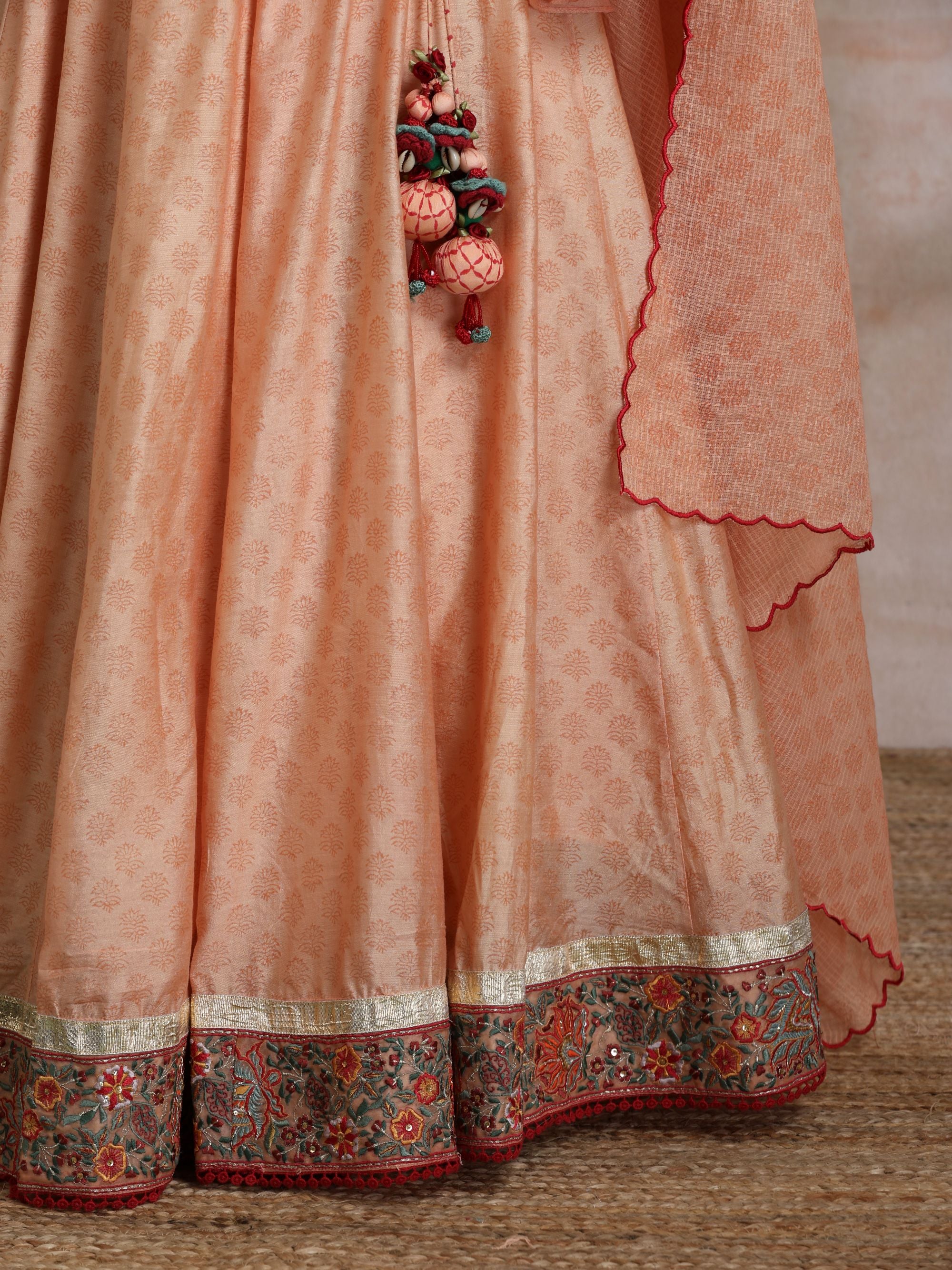 KESARI CHANDERI EMBROIDERED BORDER LEHANGA WITH BELL SLEEVES BLOUSE